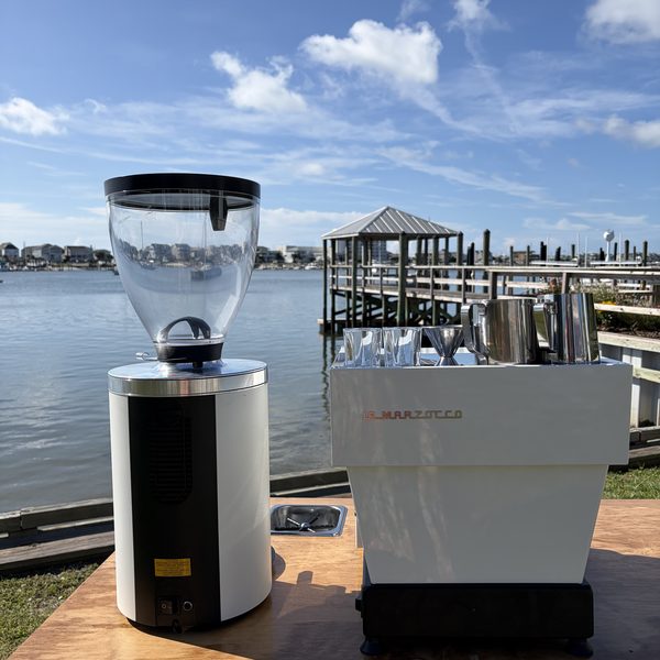 Grinder and espresso machine on the cart counter