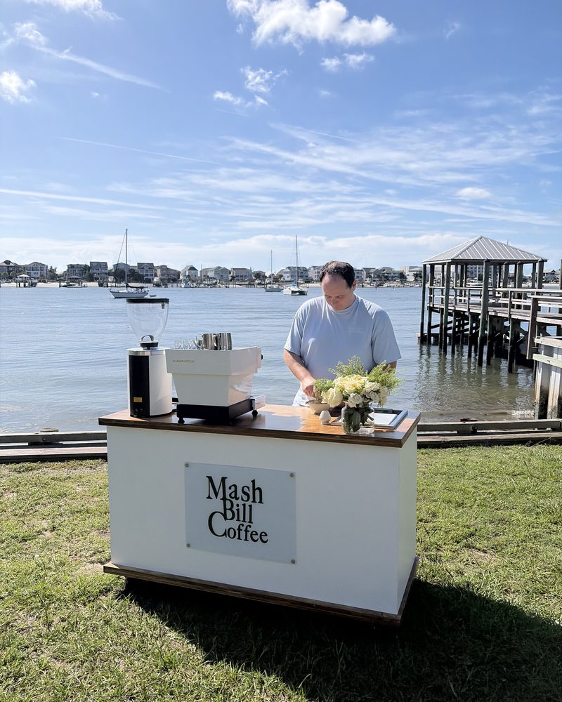 Pulling shots behind the cart at a waterfront event